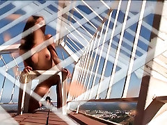 Leggy lesson damour sex masassh stands on her sunny balcony and strips