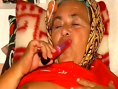 OmaPass old lady masturbating her pussy with toy and sucking
