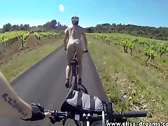 Flashing and nude in pregnath woman biking on the road