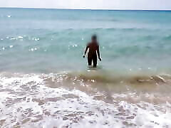 she walks naked on a indian gilma net beach while her stepfather records a video.