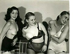 A gang of retro girls wiggle tits to the camera