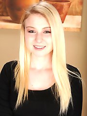 Girl next door Sophie Sativa spreads her shaved pussy.
