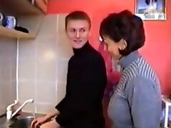 Russian mom Amalia with her boy in kitchen Russian mom Amalia with her boy in kitchen