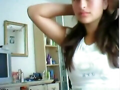 Cute brunette girl plays with her big tits and shaved slit on cam