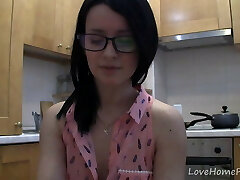 Marvelous teen with glasses chatting in the kitchen
