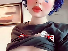 Depressed butterfly goth girl plays with her mammories