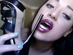 Goth cam chick with cute face licks her new high heel footwear