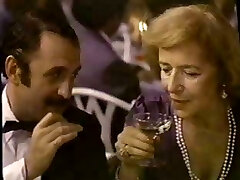 Dark Haired Brie in a movie giving service to all the high society