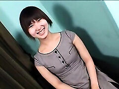 Enticing Asian shemale with a cute smile voluptuously drops he