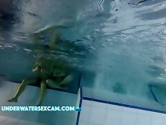 Sporty Couple Regenerating On An Underwater Bench