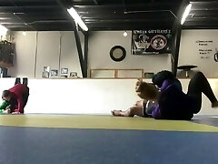 a very skilled and flexible dancer is kicking guys ass in wrestling compl