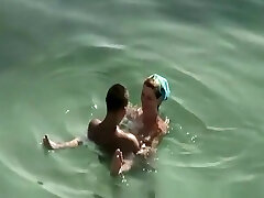 Smallish tits and puffy nipples nudist fucking in water