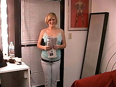 Short-haired blonde bombshell spreads legs and rubs her wet pussy