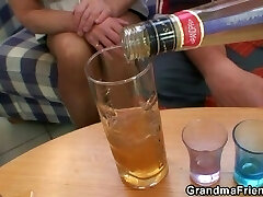 Blonde grandma takes two big peckers at once