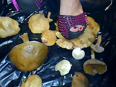 Lady L crush  mushrooms with extreme gaga high stilettos.
