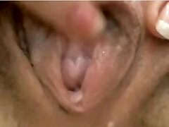 Close-up of girl playing with her pussy