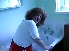 Mature dame with curly hair knows how to take a bath in a sexy way