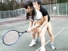 Sweet-looking asian babe spreads legs and acquires fingered