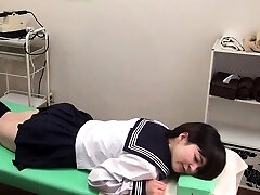 Japanese teen in schoolgirl uniform disrobed