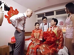 Sweet asian teen gets shared by two lustful studs in sofa after the wedding