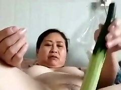 mature chubby Chinese doll with veggie