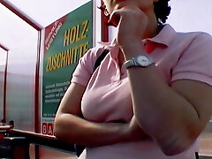 A big-chested and horny German woman enjoys pleasing her muff on a picnic