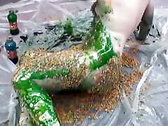 Horny naked chick plays on the floor with different sauces