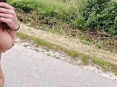 naked walking on the street among moving cars, the driver shows her tits and pussy