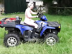 Crazy Naked Matures in floppy hats on a Quad bike