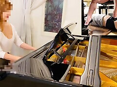 Redhead Asian Babe Teases Her Sub With Stiletto Shoes & Lets Him Eat Her Cunt While Playing the Piano