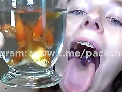 Evil white woman devours live fish in bathroom - single bad orb giante