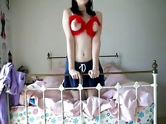 Raven haired slutty teen shows off her perky tits on webcam