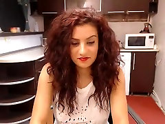 Curllynelly settled in the kitchen in front of webcam