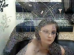 Bespectacled brunette Louiza masturbates