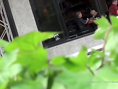 public upskit - blue suit in street cafe