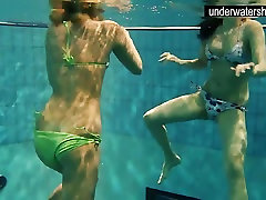 Two sexy amateurs showing their bodies off under water
