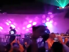 Naked fan girl runs on stage at a concert