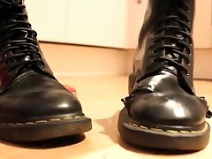 Girl wiggles her toes in soft, well worn zzvidscom gtoup Martens and crushes a toy car