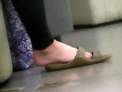 Brunette girl feet dangling
