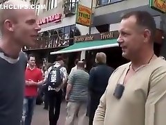 Gorgeous hooker puts jo-bag on cock and gives hot blowjob