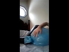 humping bags wearing shiny black leggings