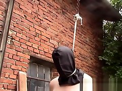Tied up captive with a hood and a noose