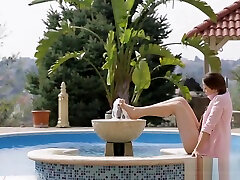 Teen babe giving footjob