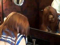 Cute girl in uniform spanked hard as she squeezes cock between her tits