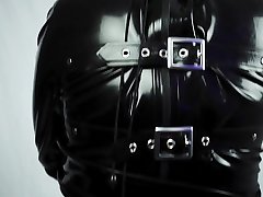 gimp struggles in straight jacket and deprivation hood