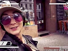 german instagram girl pick up a Fan on Street in supermarket