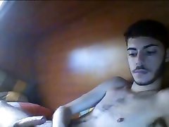 handsome bearded skinny guy jerking off his uncut cock