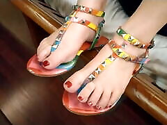 Sexy red toenails and Multi-color thong sandals