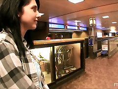 Darh haired Lexi has fun with vegetables in a public store