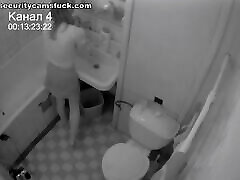 A girl moans wildly while fucking herself in the bathroom